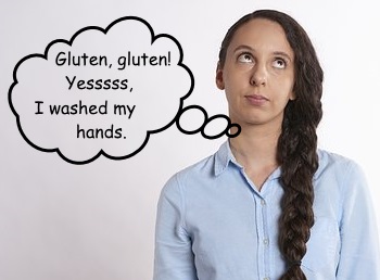 Girl with eyes rolled, saying, "gluten, gluten, Yes I washed my hands."