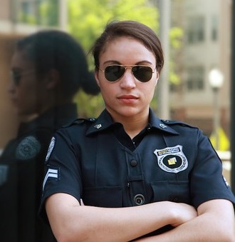 Picture of a police officer in sunglasses.